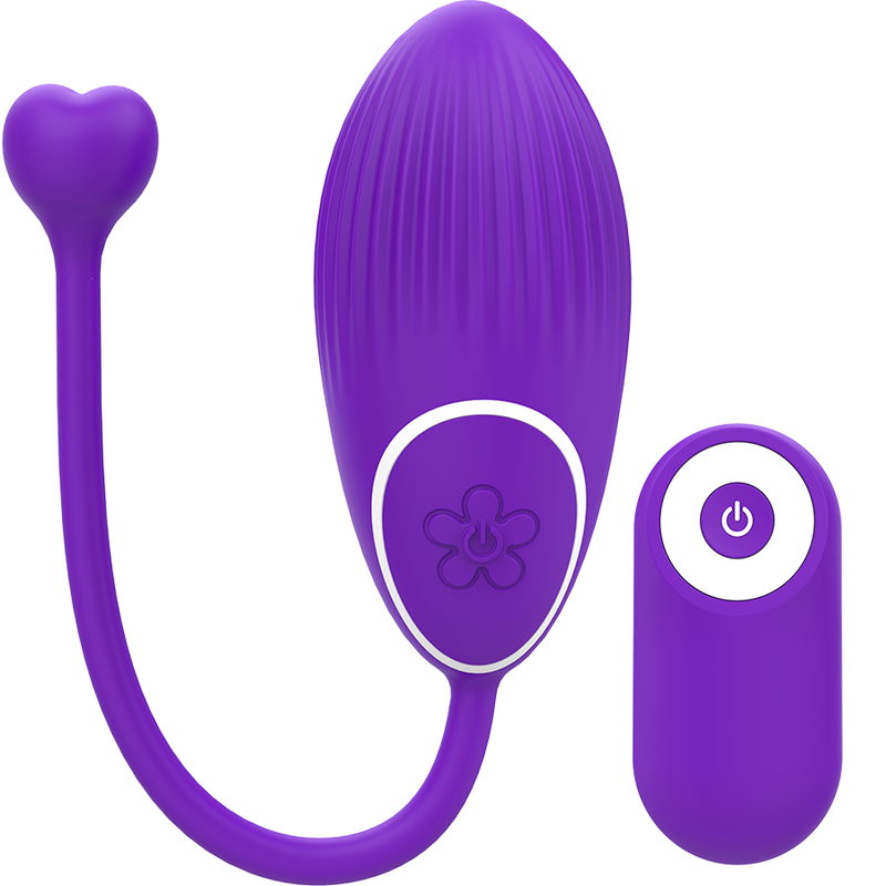 Un dispositivo de bienestar morado en forma de huevo con mango de corazón y un pequeño control remoto.