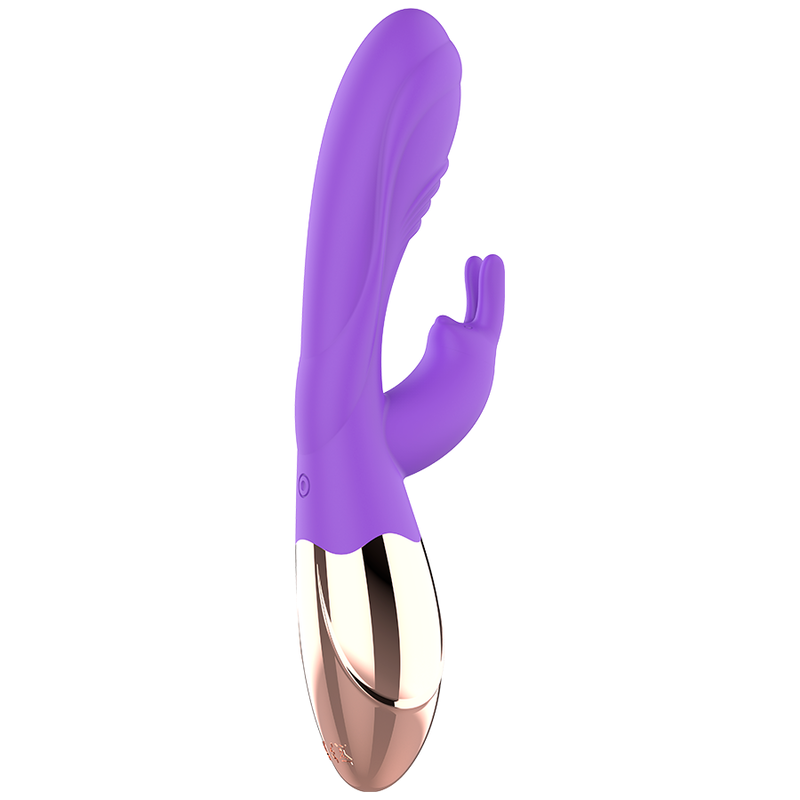 Un dispositivo de bienestar morado y dorado con dos accesorios sobre un fondo blanco.