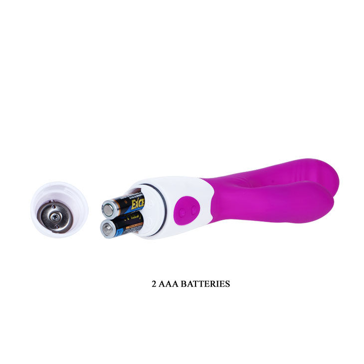 Juguete vibrador morado con compartimento de pilas abierto mostrando dos pilas AAA.