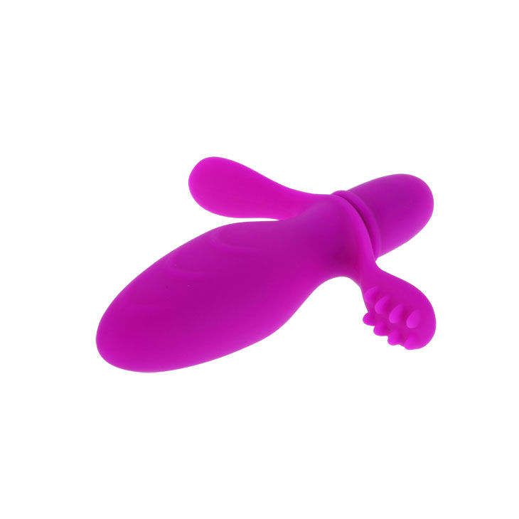 Ein lilafarbenes Wellness-Silikonprodukt mit geschwungenen Formen und kleinen Noppen auf weißem Hintergrund.