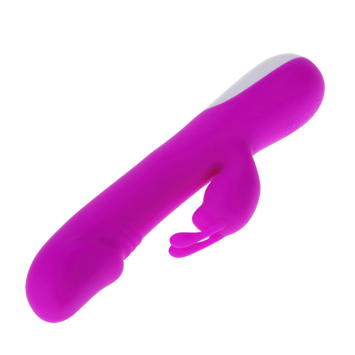 Un vibrador de silicona morado y liso con forma curva y dos brazos de estimulación sobre fondo blanco.