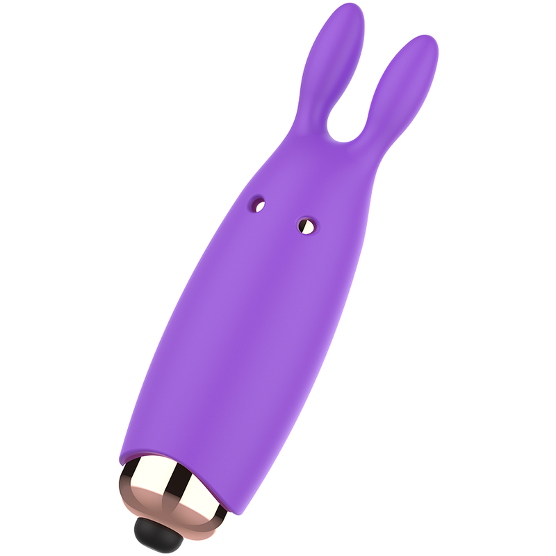 Un dispositivo de silicona morado en forma de conejo con base de oro rosa y punta negra sobre fondo blanco.