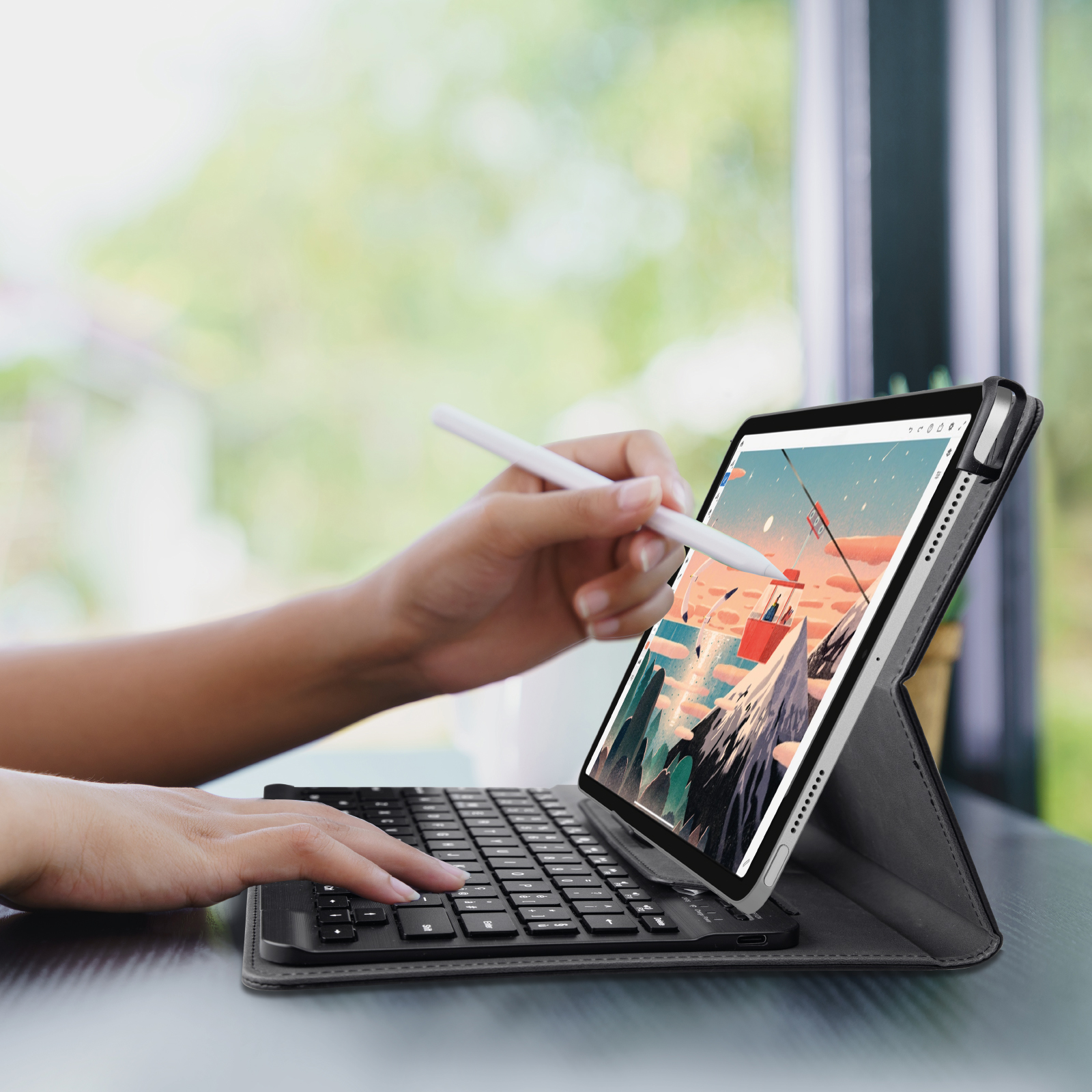 Una persona usa un lápiz óptico en una tableta con funda de teclado, mostrando un paisaje montañoso.