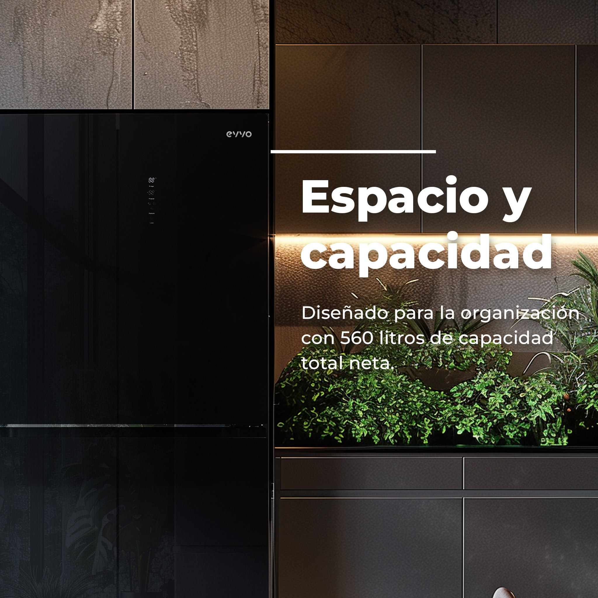 Cocina moderna negra con frigorífico y decoración vegetal iluminada.