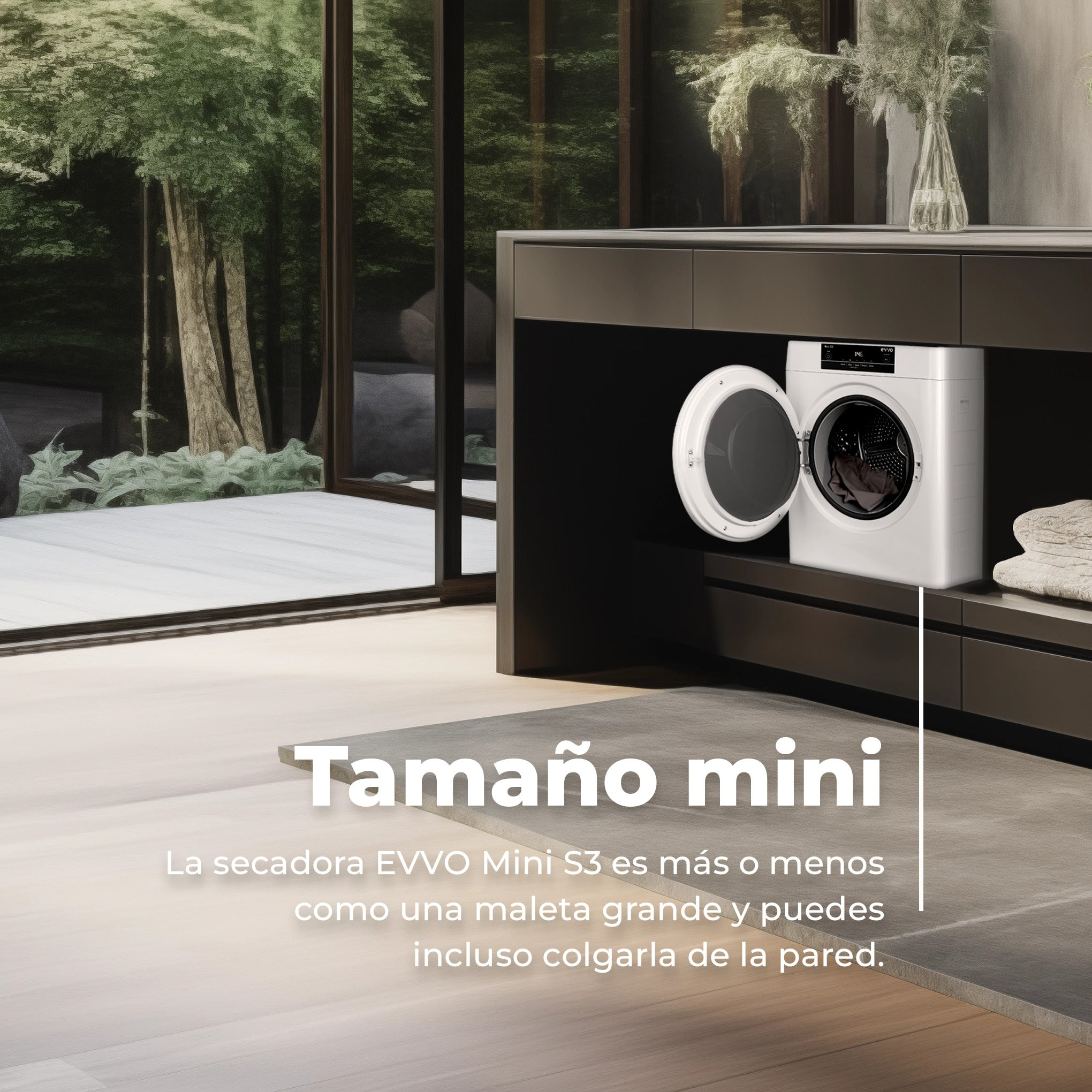 Una secadora blanca compacta está instalada en un mueble de cocina oscuro junto a una gran ventana con vistas.