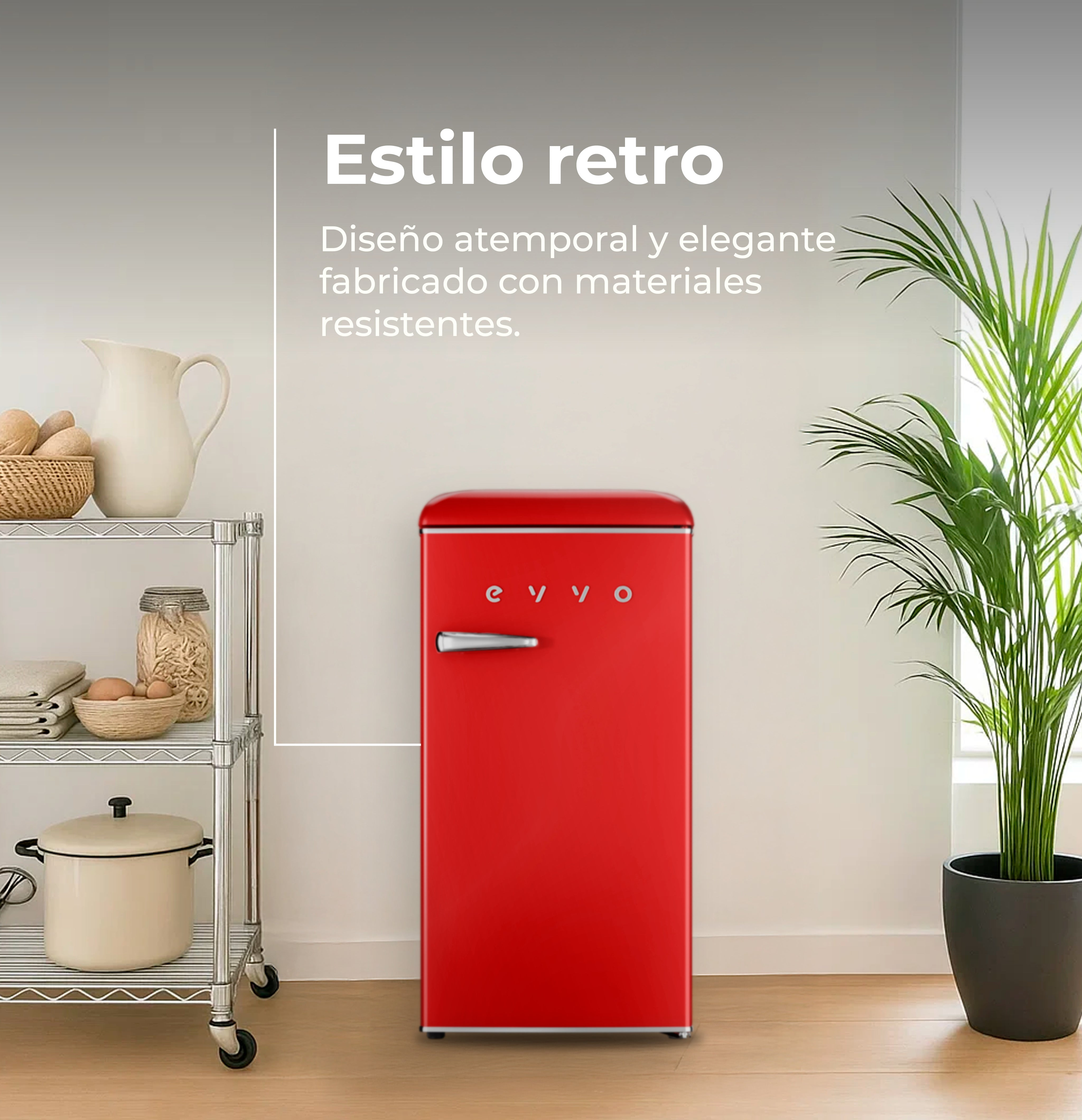 Una nevera retro de color rojo brillante se encuentra en una cocina junto a una estantería de metal y una planta.