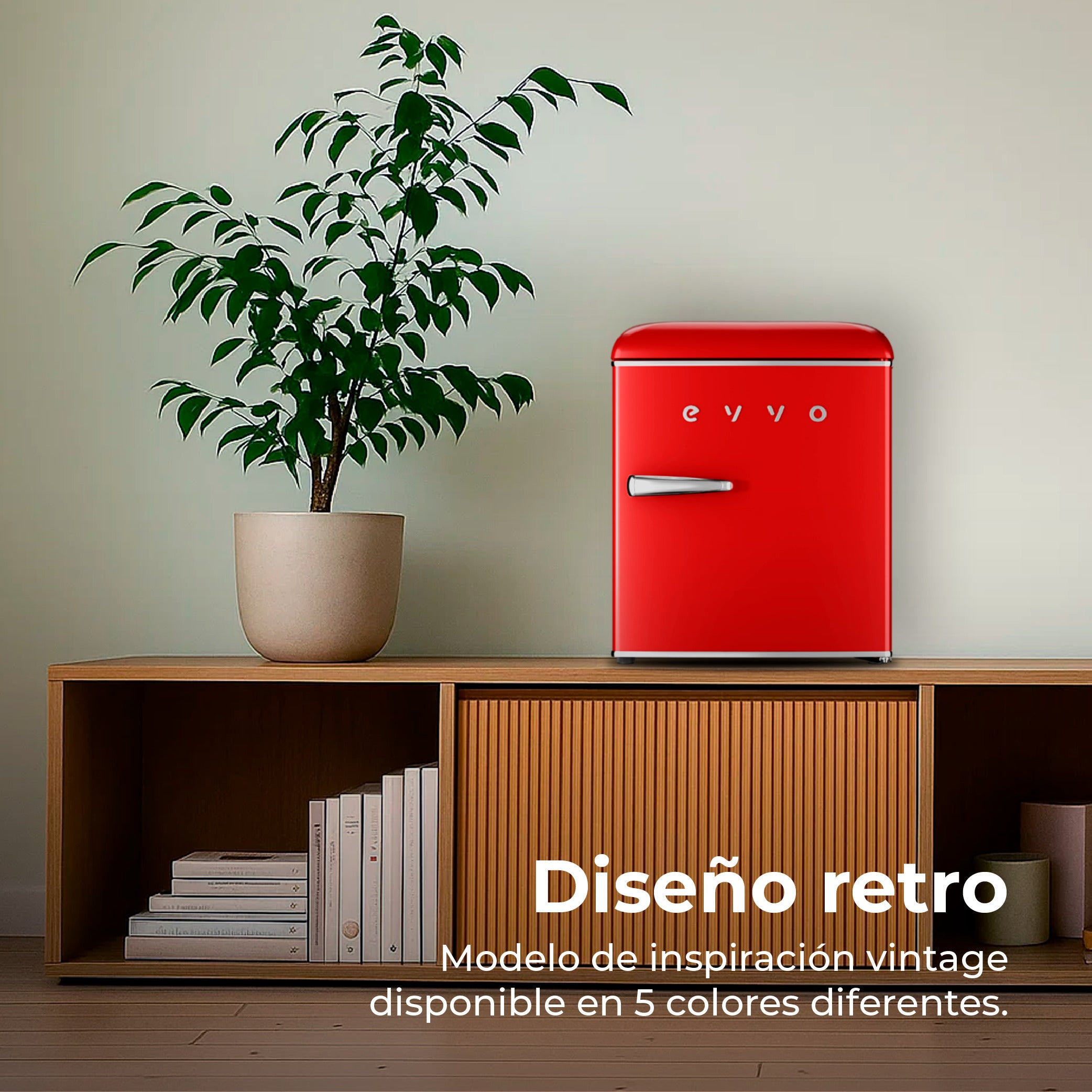 Una mini nevera roja de estilo retro sobre un mueble de madera junto a una planta.