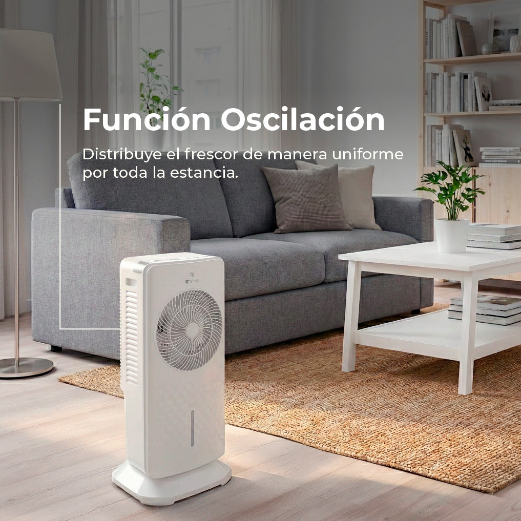 Un ventilador de torre blanco en una sala frente a un sofá.