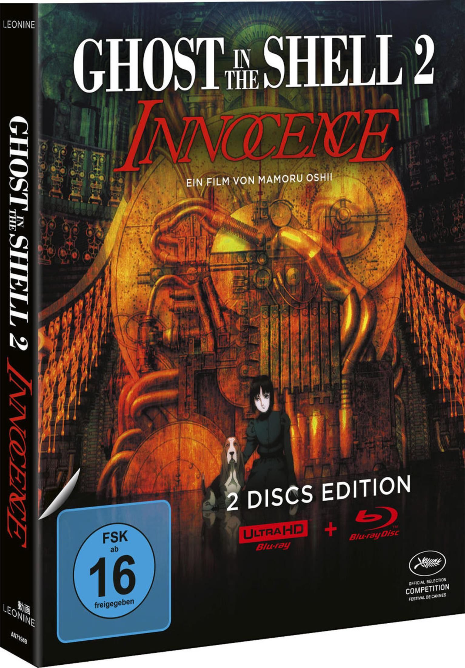 Ghost in the Shell 2: Innocence Blu-ray-Cover mit einer Figur und einem Hund vor einem goldenen, industriellen Maschinenhintergrund.