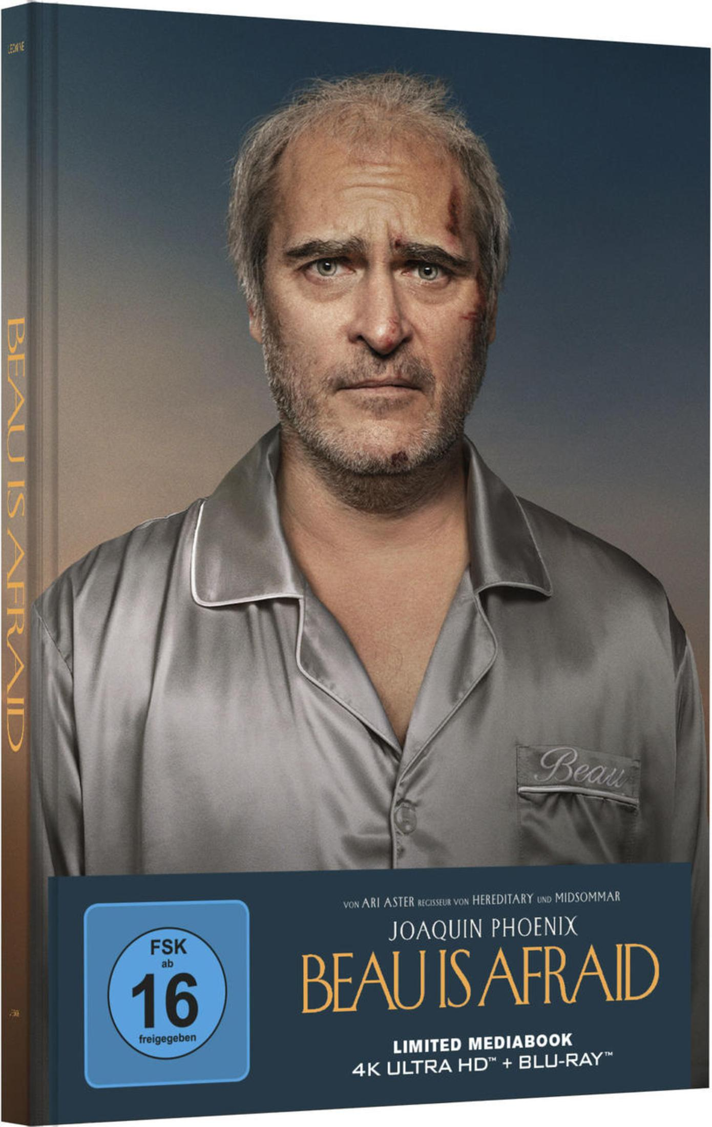Joaquin Phoenix als Beau in Seidenpyjama mit Schnittwunden auf einem Filmcover.