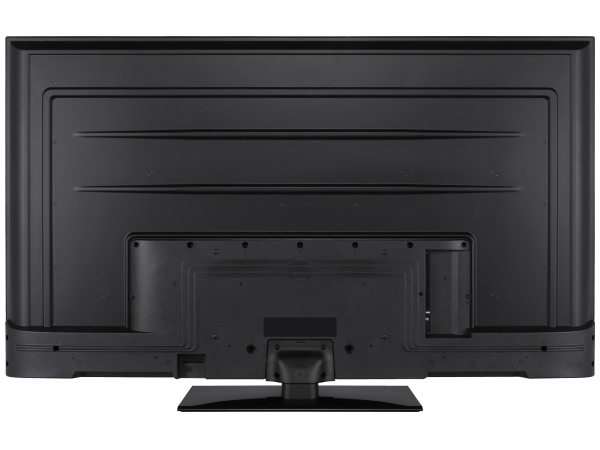 Vista posterior de un televisor moderno de pantalla plana negro en un soporte de mesa.