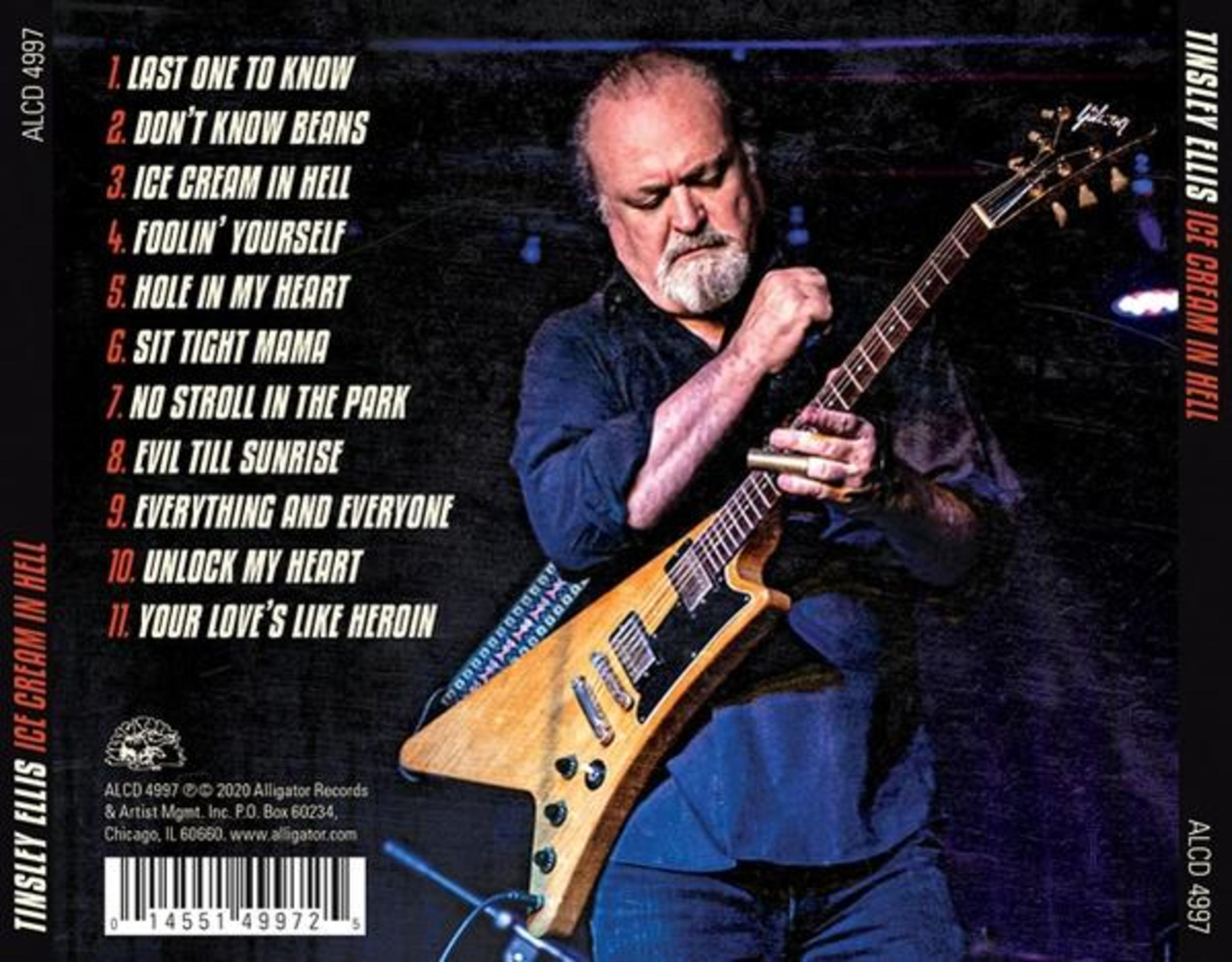 Tinsley Ellis spielt eine gelbe Gitarre auf der Bühne, neben einer Titelliste von "Ice Cream in Hell".