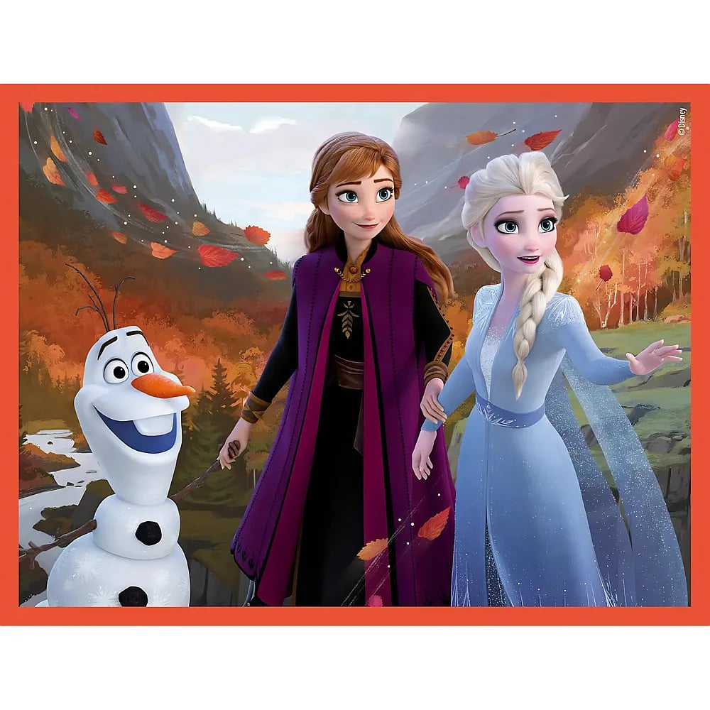 Anna in viola, Elsa in azzurro e Olaf il pupazzo di neve in un paesaggio montano autunnale con foglie.