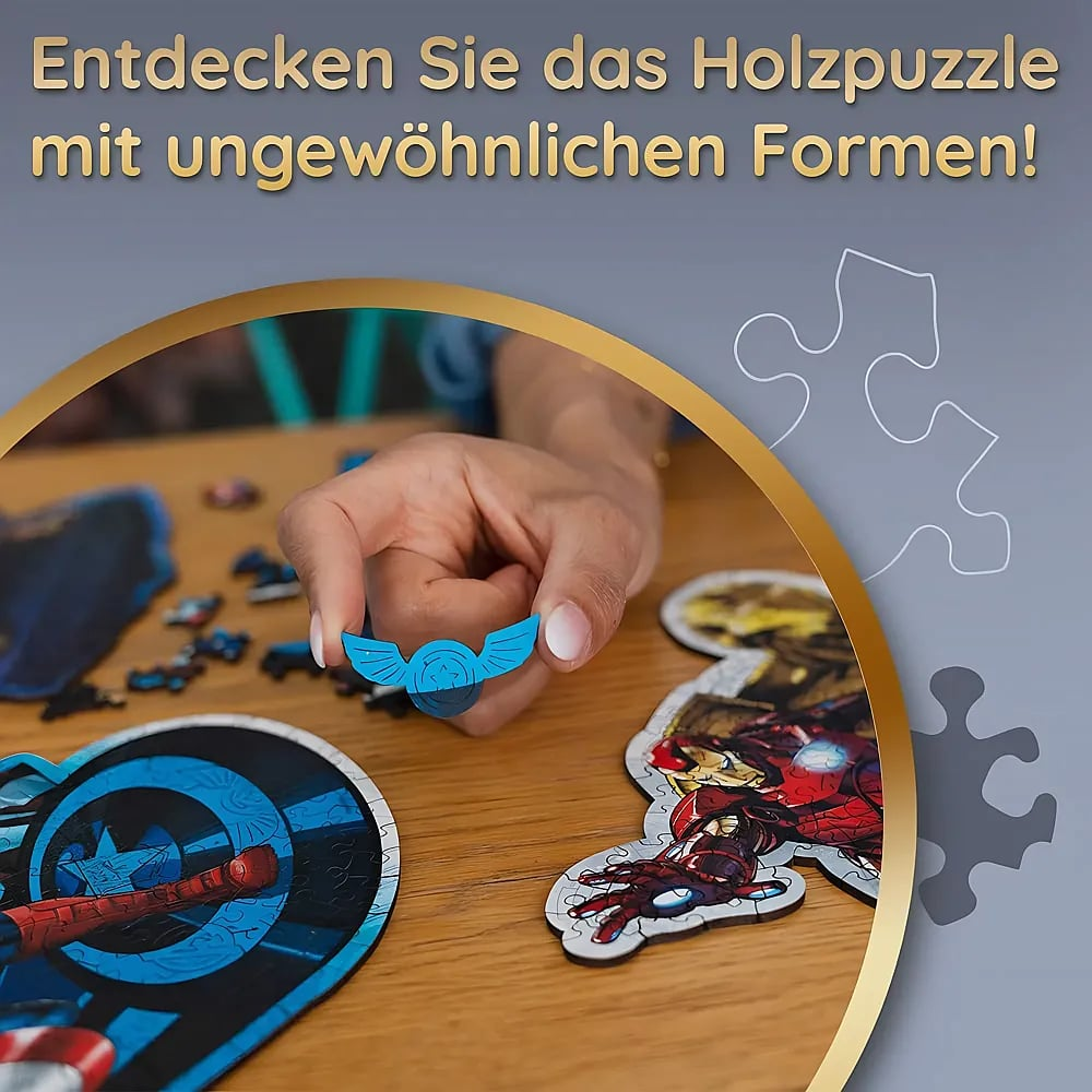A hand holds a blue puzzle piece over a wooden table with incomplete puzzle pieces.