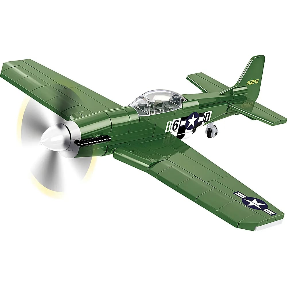 Un avion jouet vert avec une hélice qui tourne et des insignes américains sur fond blanc.