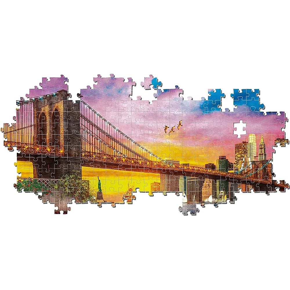 Een onvoltooide puzzel toont de Brooklyn Bridge en de skyline van New York bij zonsondergang.
