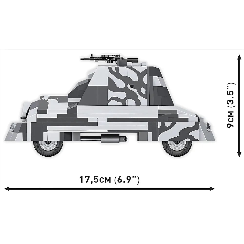 Ein Spielzeug-Panzerwagen mit grauem Tarnmuster, einem Maschinengewehr und Maßpfeilen für 17,5 cm mal 9 cm.