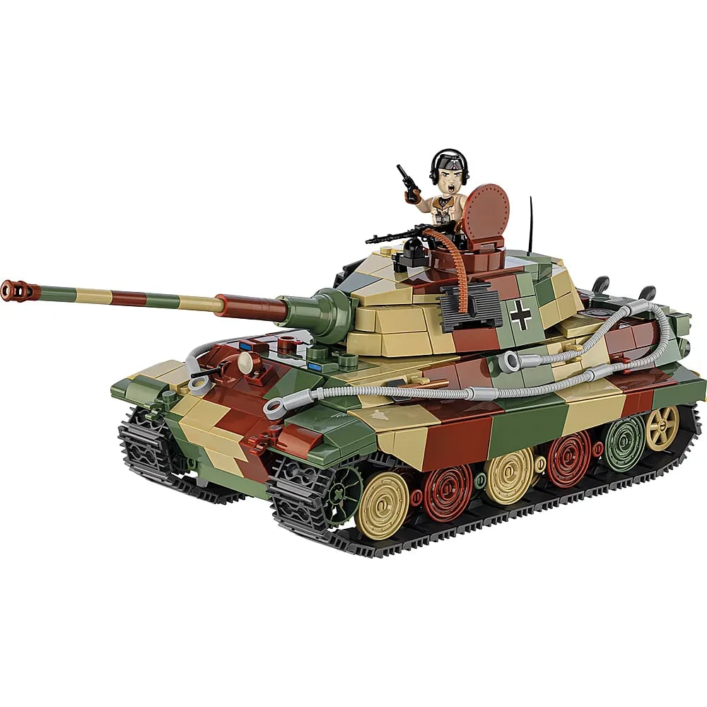 Un char de jouet en blocs camouflé avec motif rouge-marron-vert, chenilles et une figurine dans la tourelle.