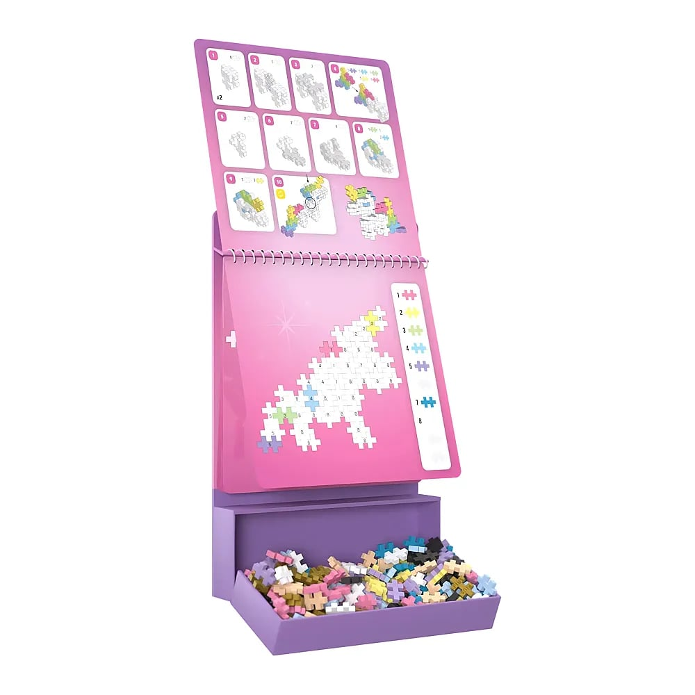 Un expositor de unicornio rosa con piezas coloridas en la caja inferior e instrucciones arriba.