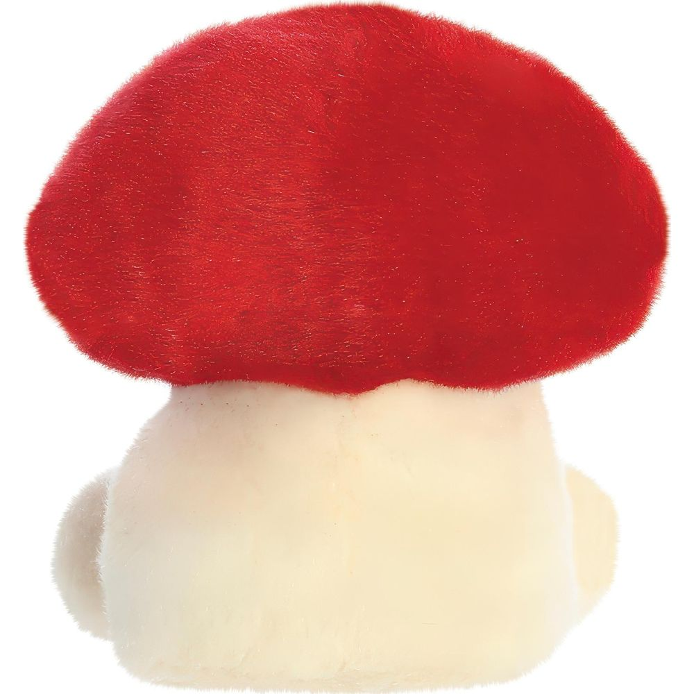 Ein Plüschpilz mit leuchtend rotem Hut und cremeweißem Stiel vor weißem Hintergrund.