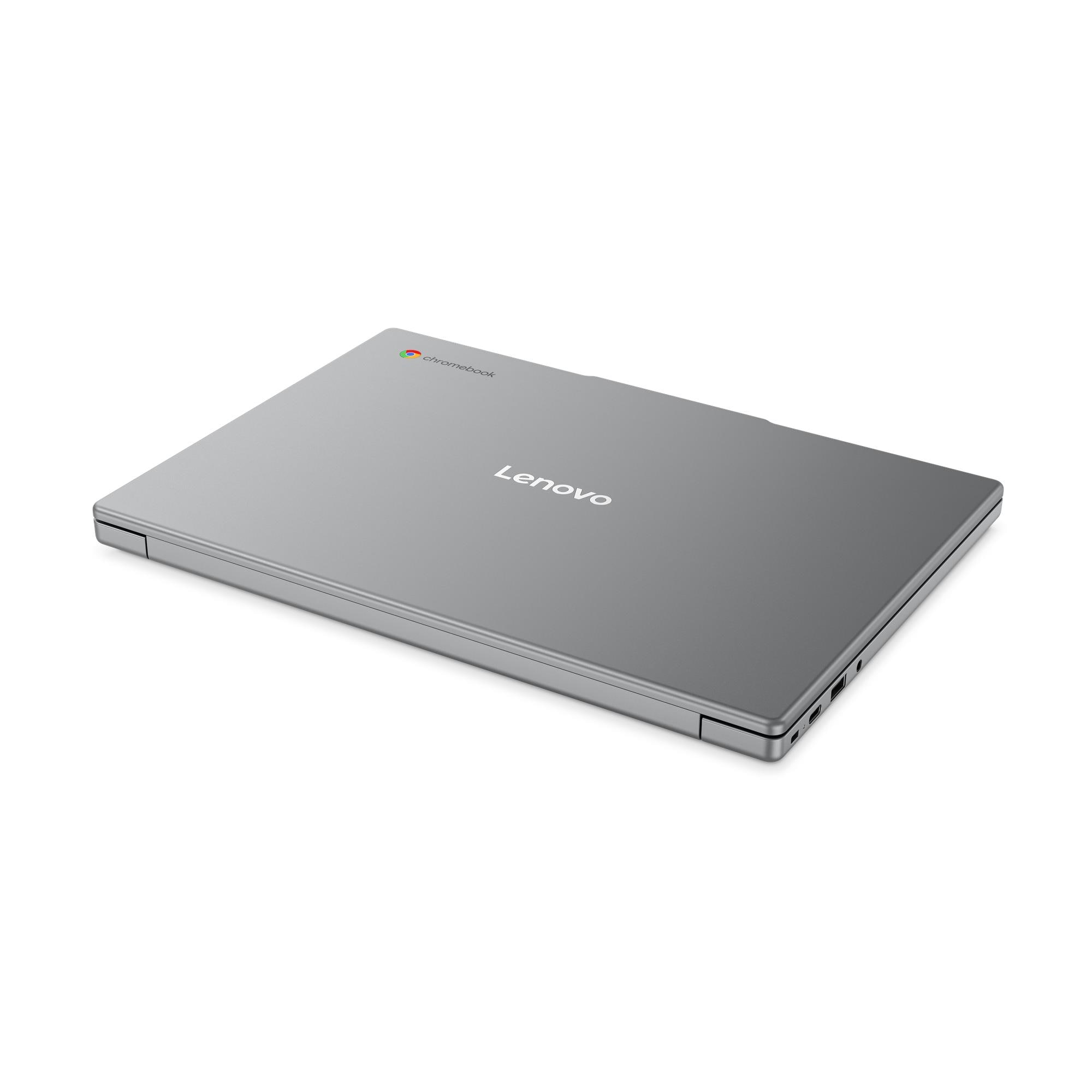 Un laptop Lenovo Chromebook grigio chiuso posato su una superficie bianca.