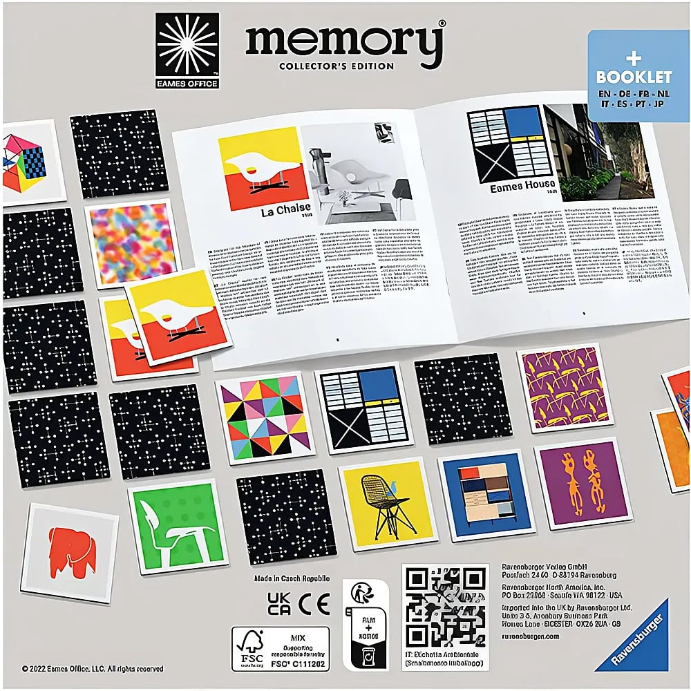 Ein offenes Eames Office Memory-Spiel mit bunten Karten, einem Heft und einem Prospekt auf einer flachen Oberfläche.