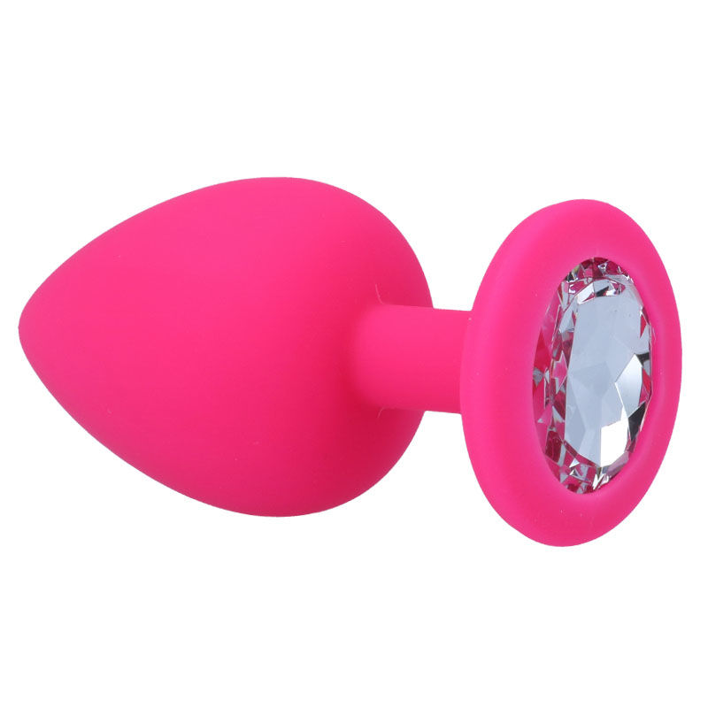 Ein pinker Analplug aus Silikon mit einer großen funkelnden Raute als Basis auf weißem Grund.