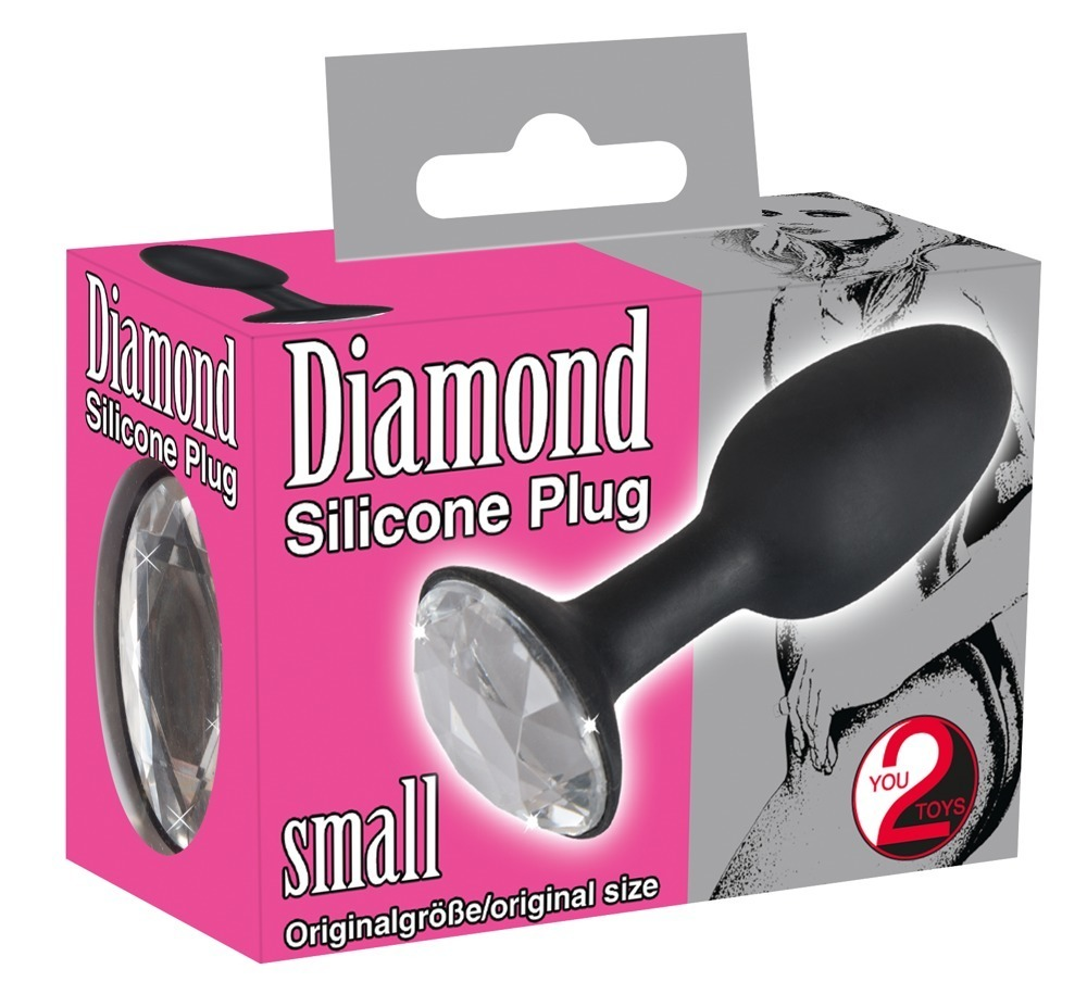 Rosa-graue Verpackung eines schwarzen Diamond Silicone Plug small mit funkelndem Edelstein.