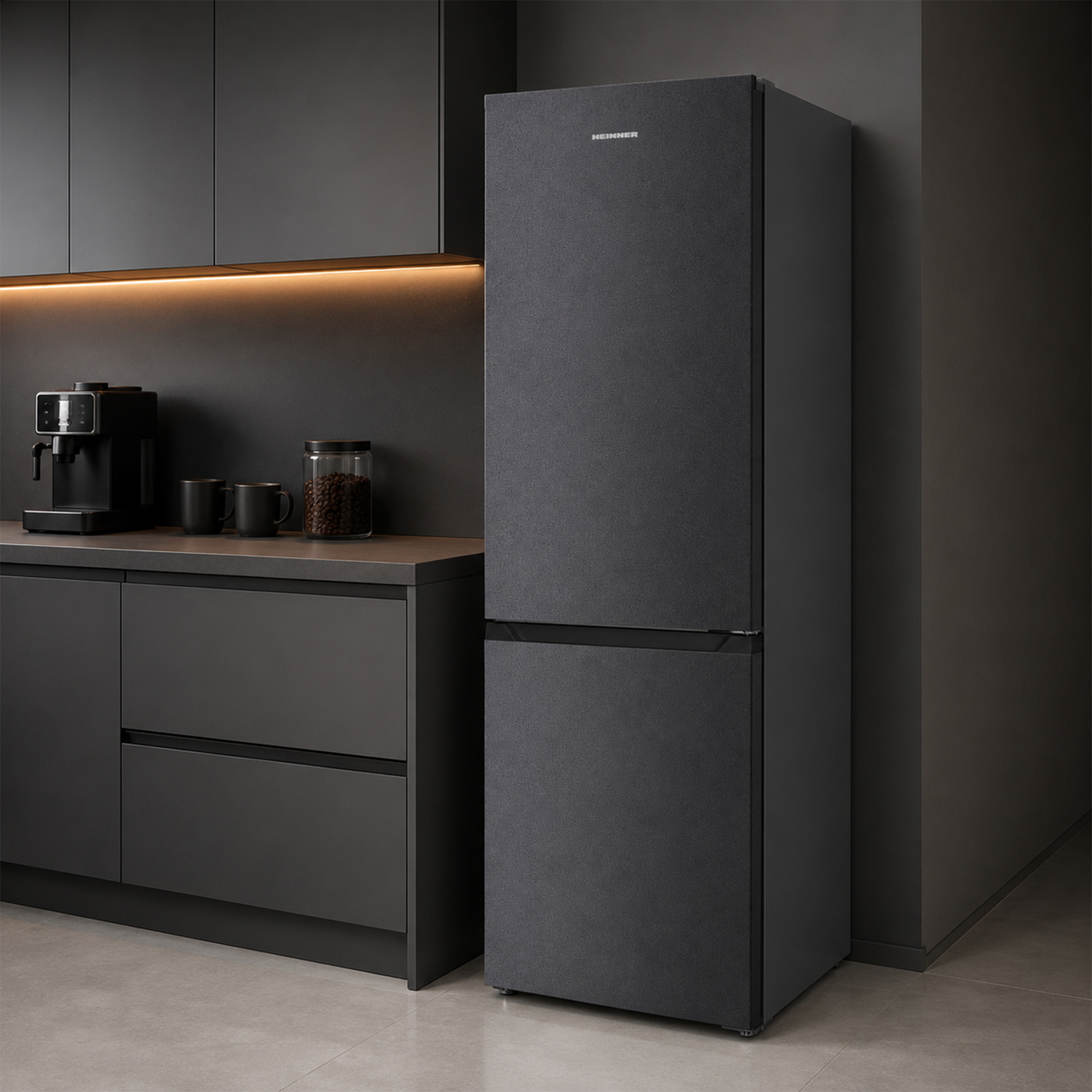 Modern dark kitchen with matte black refrigerator, coffee maker, and illuminated cabinets.