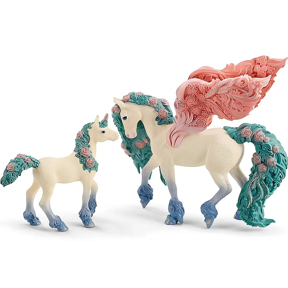 Zwei Spielzeug-Einhorner mit floralen Mahnen und Schweifen, ein erwachsenes geflügeltes Pegasus und ein Fohlen.