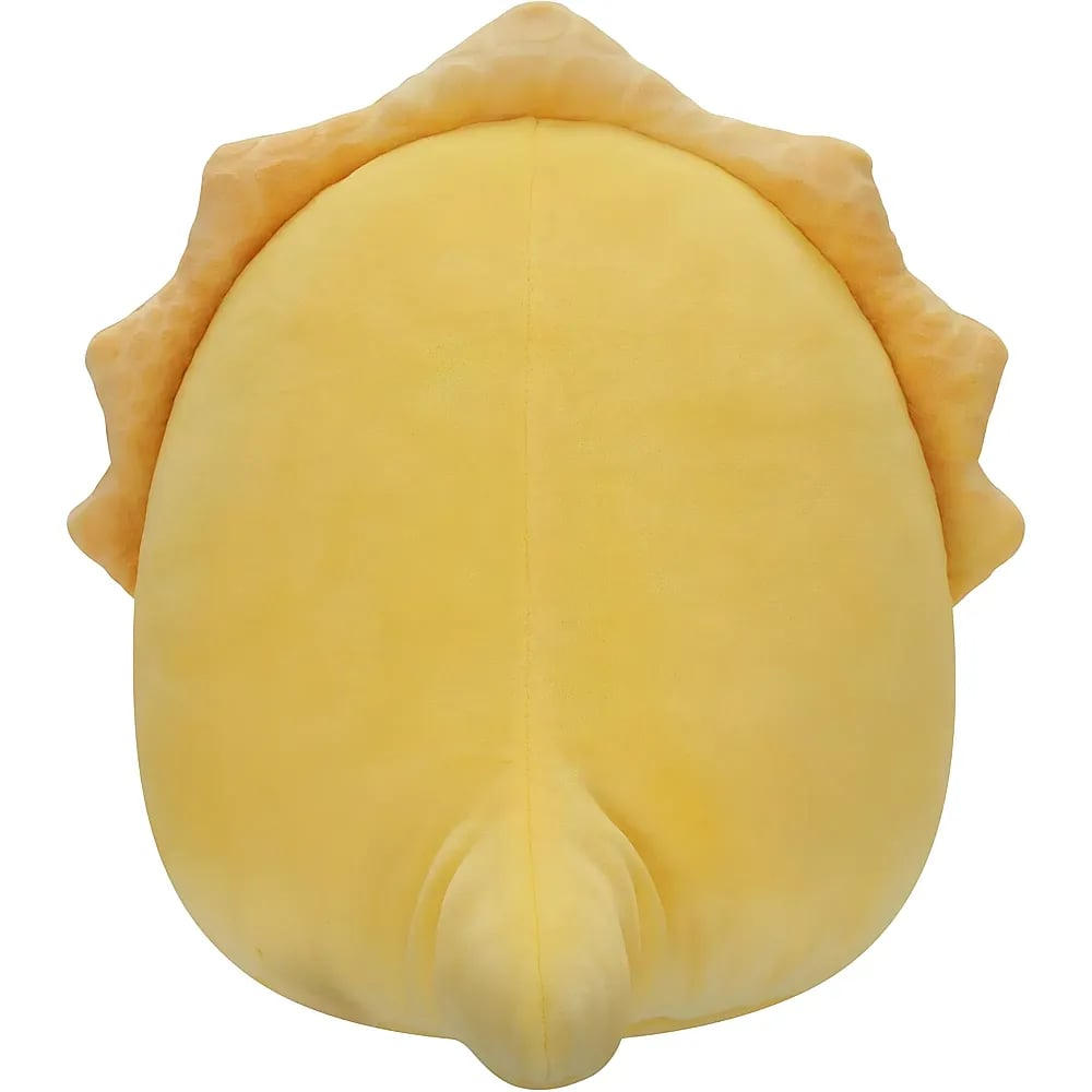 Ein gelbes Stofftier mit wellenförmigen Verzierungen am Rand und einer kleinen Schwanzspitze unten.