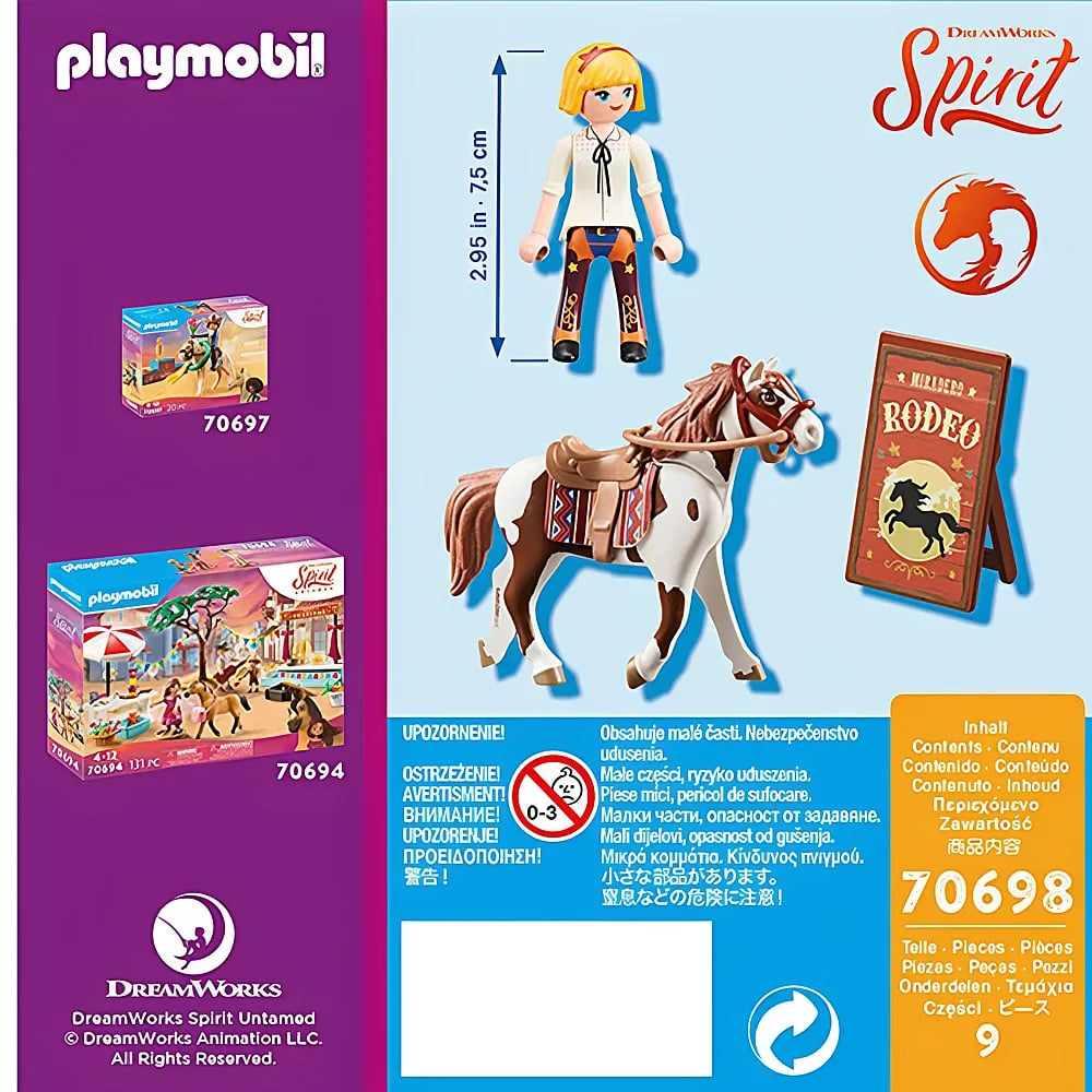 Set Playmobil Spirit con figura bionda, cavallo bianco e marrone, sella e cartello rodeo su sfondo blu e viola.