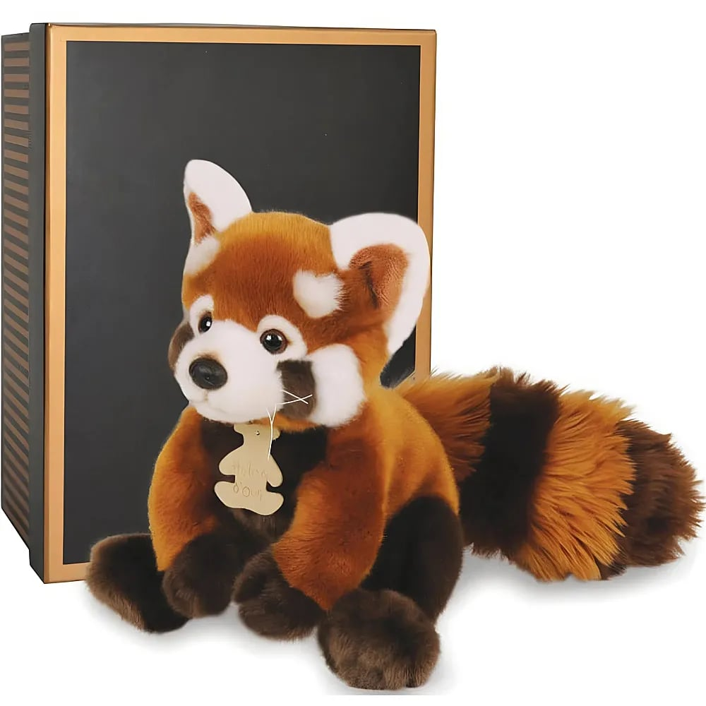 Ein Plüsch-Roter Panda sitzt vor einer schwarzen und goldenen Geschenkbox.