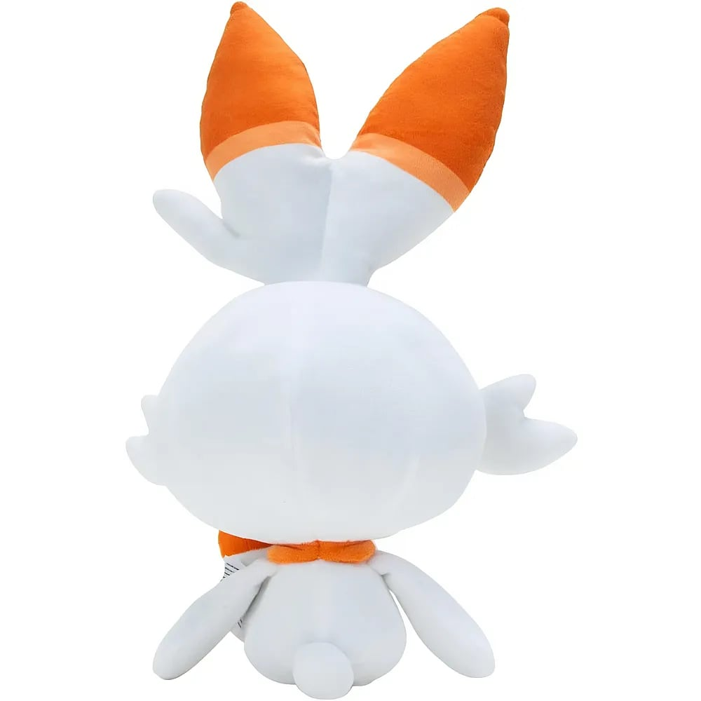 Vista trasera de un peluche blanco y naranja con orejas largas y cola pequeña sobre fondo blanco.