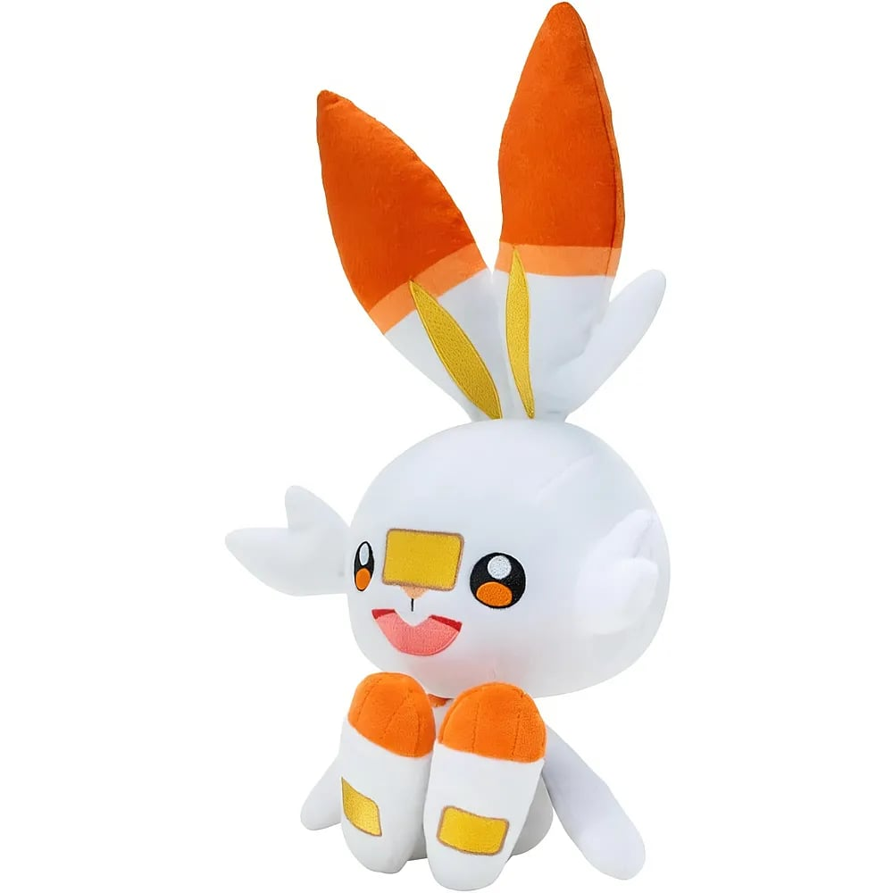 Un conejito de peluche blanco y naranja con orejas grandes, marcas amarillas en la nariz y cara feliz.