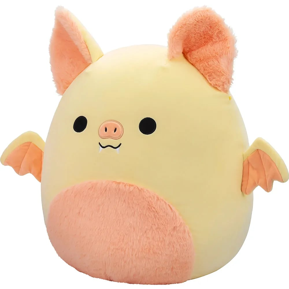 Une chauve-souris vampire en peluche ronde et jaune avec des oreilles, des ailes et un ventre orange sur fond blanc.
