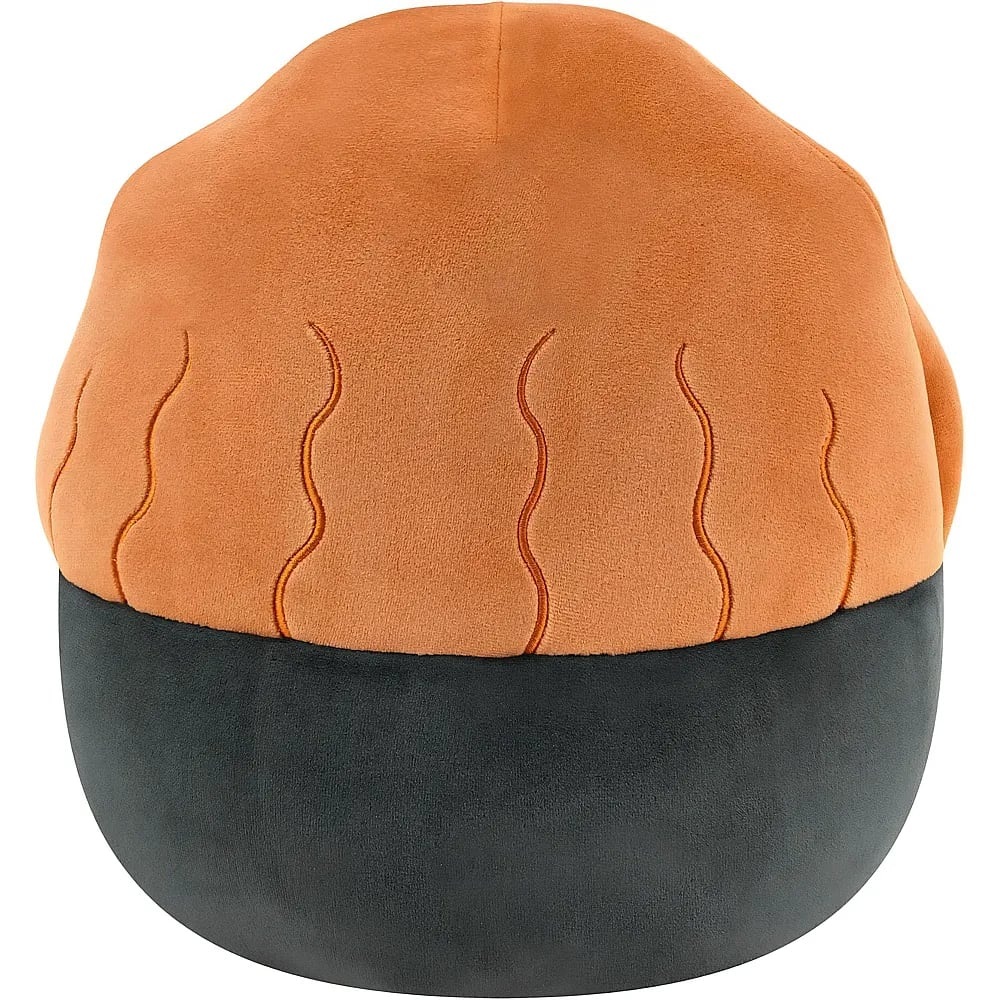 Ein weiches Plüschkissen mit orangefarbener Oberseite und Wellennähten sowie einer dunklen Unterseite vor weißem Hintergrund.