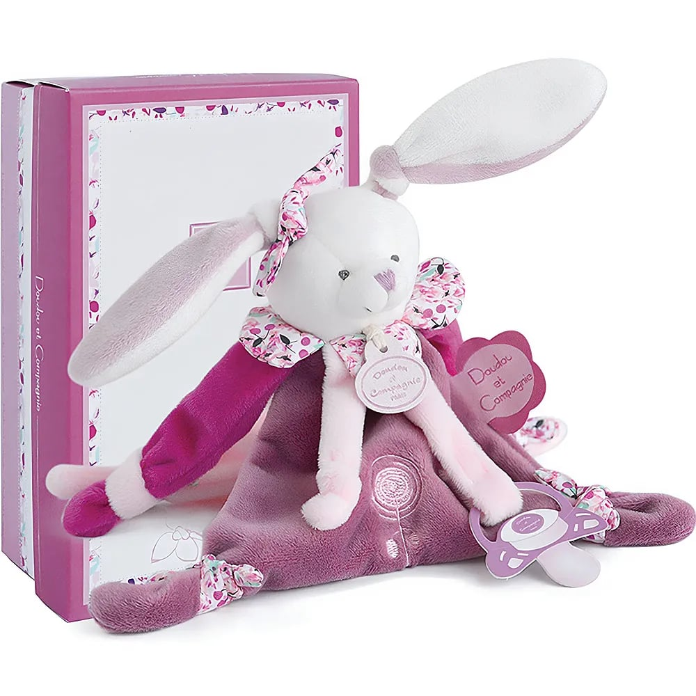 Una copertina di peluche a forma di coniglietto bianco e rosa davanti a una scatola.