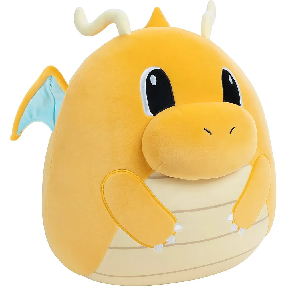 Ein rundes, gelbes Dragonite-Plüschtier mit kleinen blau gefütterten Flügeln, weißen Hörnern und weißem Bauch.