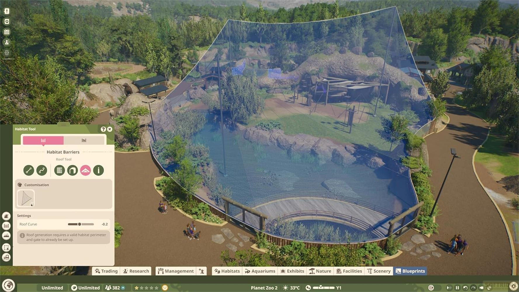 Vue de Planet Zoo avec l'outil d'habitat, filet bleu sur un enclos avec de l'eau et des rochers.