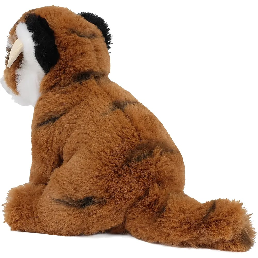 Seitenansicht eines braun-schwarzen Plüsch-Säbelzahntigers vor weißem Hintergrund.