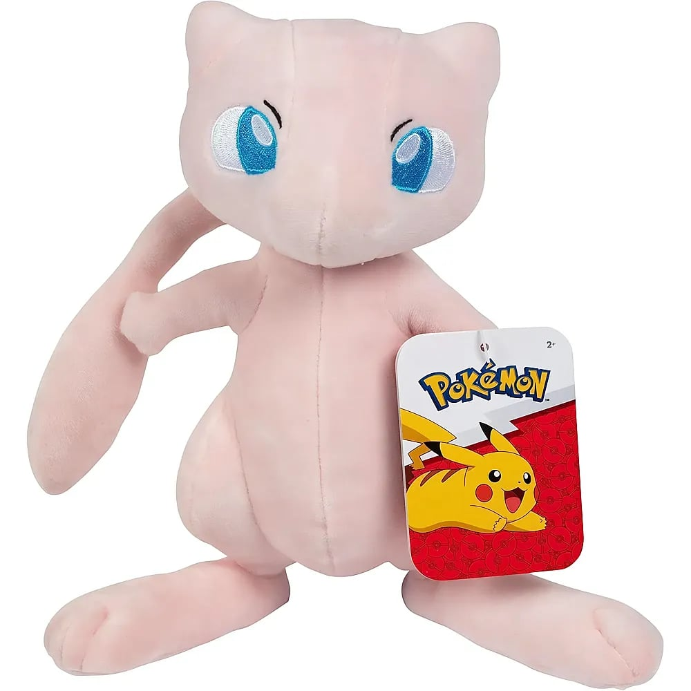 Ein rosafarbenes Mew-Plüschtier mit großen blauen Augen und einem Pokémon-Etikett vor weißem Hintergrund.