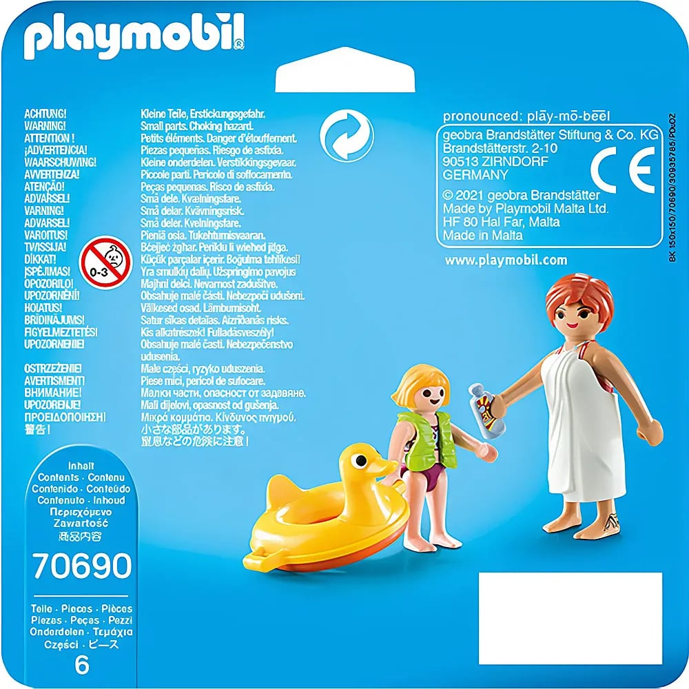 Confezione Playmobil con avvertenze di sicurezza, marchio CE e personaggi con salvagente e anatra.