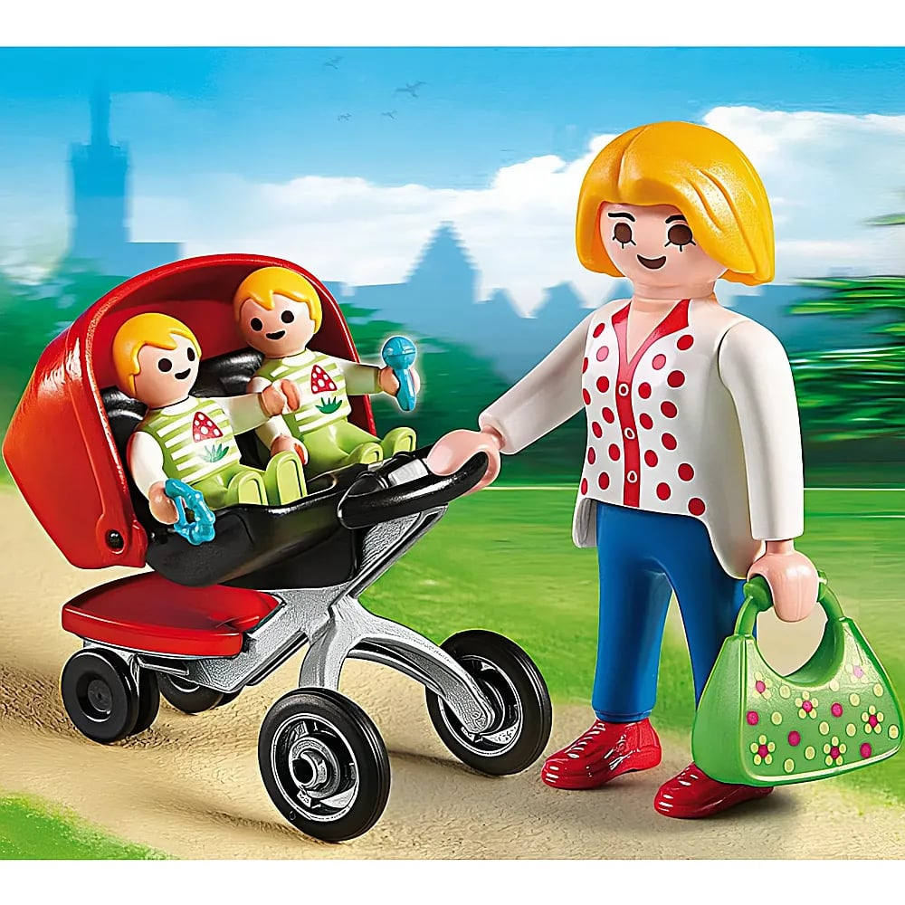 Playmobil-Mutter mit blonden Haaren schiebt einen roten Zwillingswagen mit zwei Babys und hält eine grüne Handtasche.