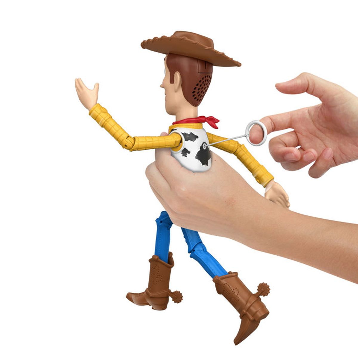 Eine Hand zieht an der Zugschnur auf der Rückseite einer Woody-Actionfigur.