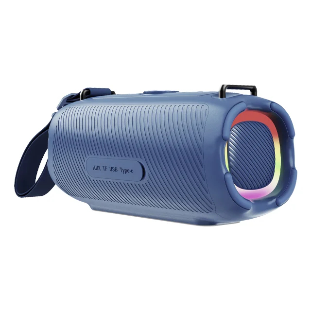 Niebieski cylindryczny głośnik bluetooth z paskiem, żebrowaną obudową i świecącym pierścieniem RGB.