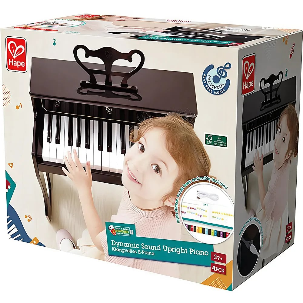 Verpackung eines Hape Dynamic Sound Upright Piano mit einem lächelnden Kind, das die Tasten berührt.