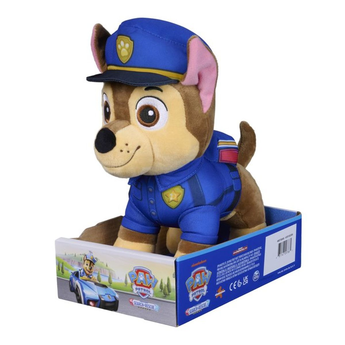 Eine Plüschfigur von Chase aus Paw Patrol in einer blauen Polizeiuniform und Mütze steht in einer bunten Verpackung.