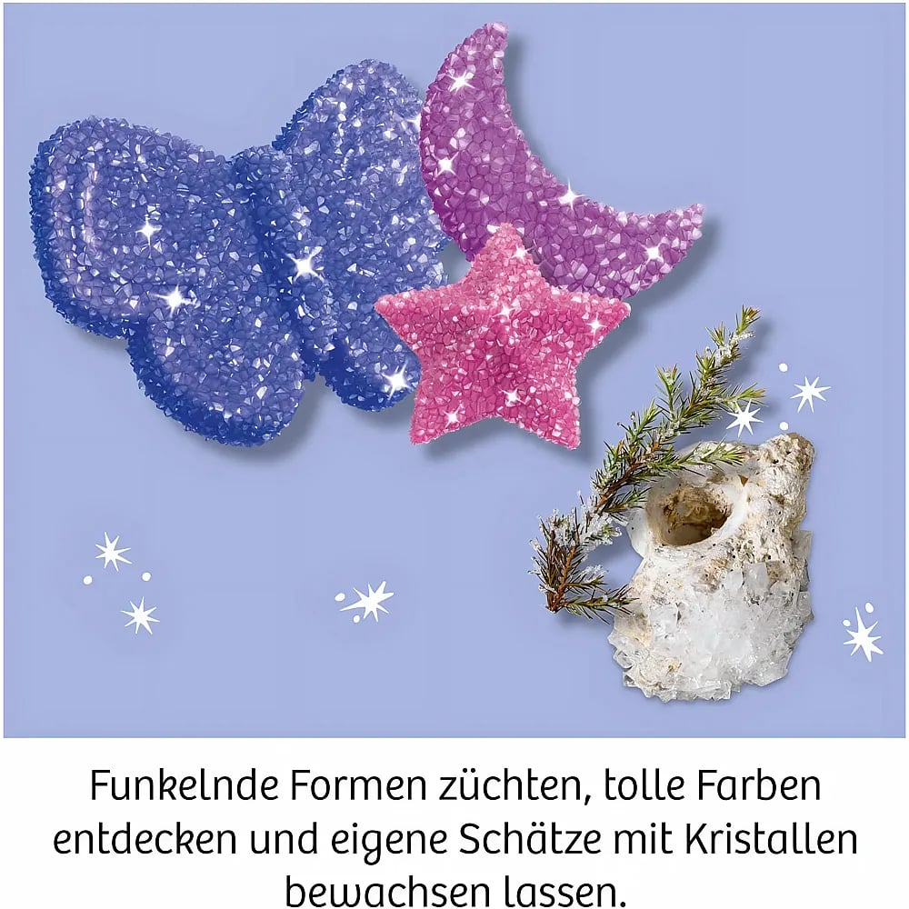 Cristaux scintillants en forme de papillon, lune et étoile sur fond bleu clair avec texte.