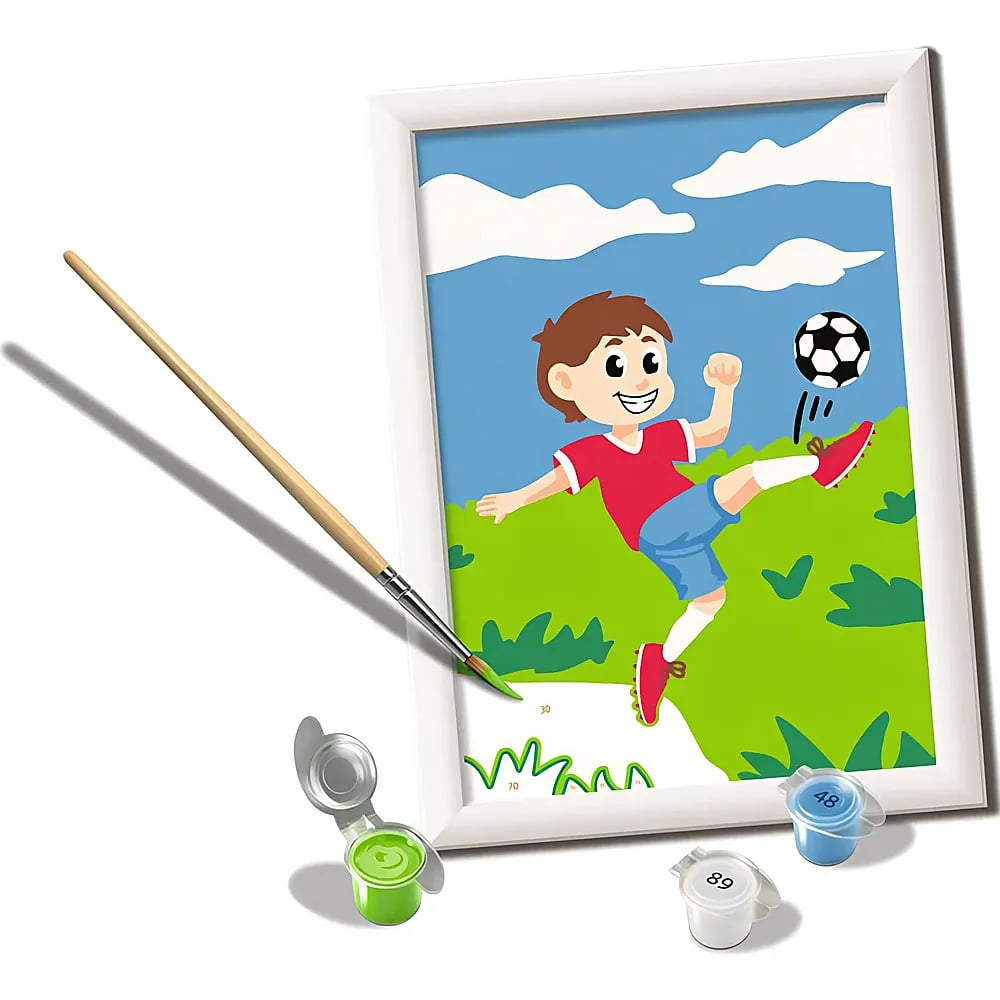 Un set di pittura con i numeri mostra un ragazzo che gioca a calcio, con pennello e barattoli.